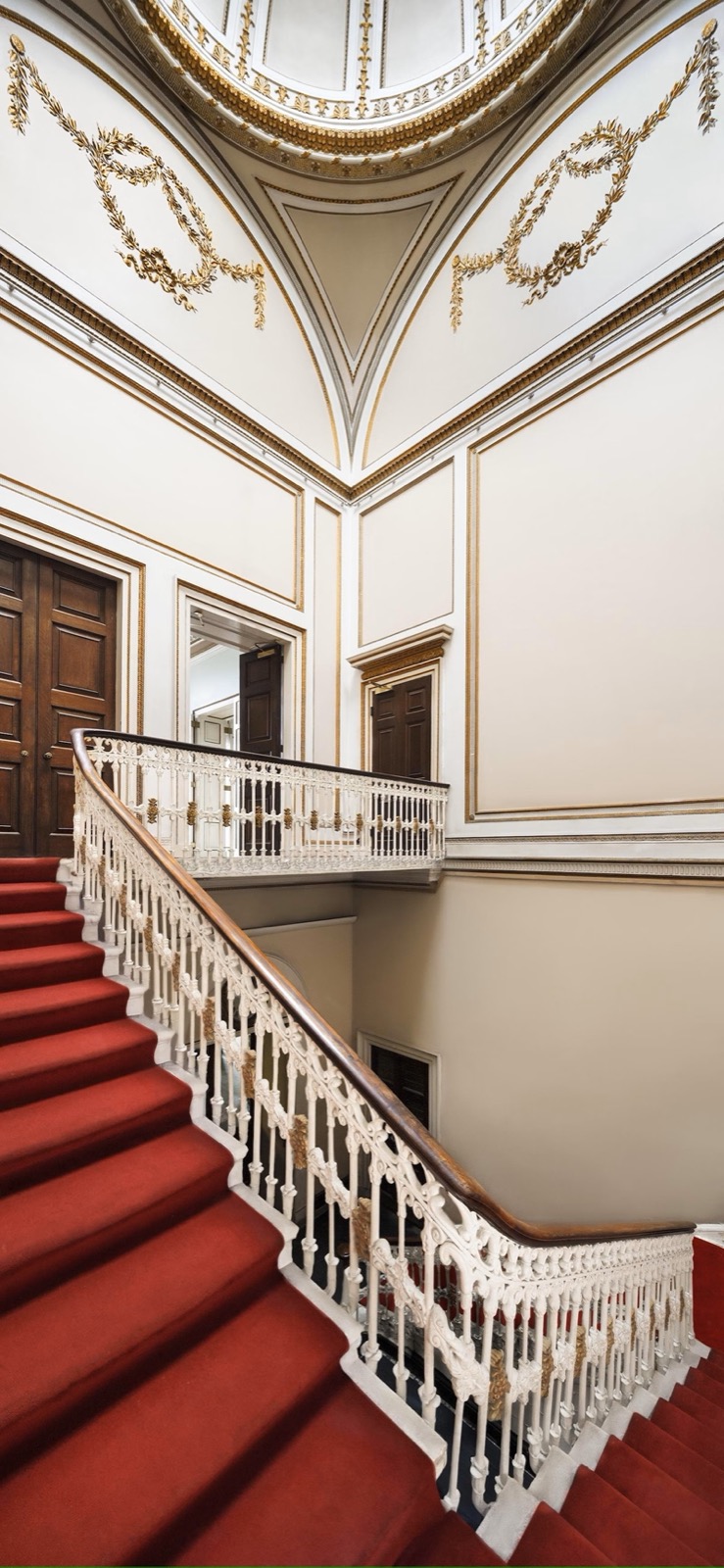A grand staircase inside Cambridge House, finished to a flawless standard